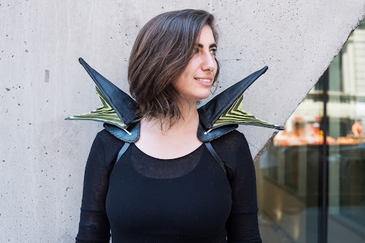Winged Woman Photo of a woman wearing wing-like extrusions on her shoulders